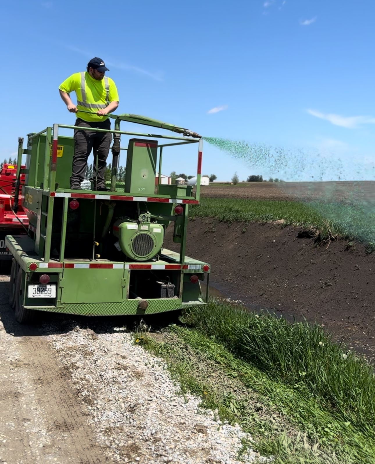 BHC Road Crew mulches newly seeded ditch
